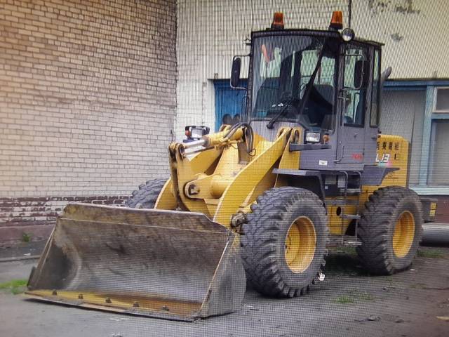 Погрузчик хабаровск. Экскаватор-погрузчик New Holland b115. Нью Холланд 115. Экскаватор-погрузчик New Holland b80b. Вилочный погрузчик New Holland.