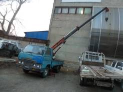 Mazda Titan, 1989 во Владивостоке Mazda Titan. Манипулятор стрела 5.5 метра, 2 500 куб. см., 1 500 кг., 4x2